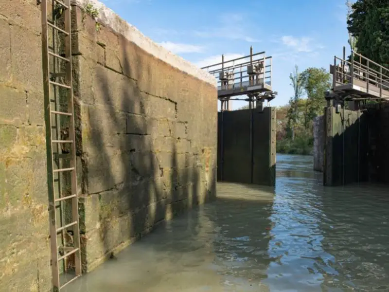 Carcassonne France, A lock in Canal du Midi opens after filling water 