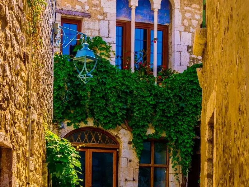 Saint-Paul-de-Vence France, A beautiful lamp and vine covered facade