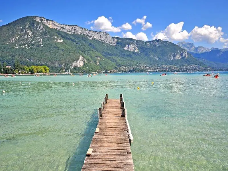 Annecy France, A dock in a beach in Lake Annecy